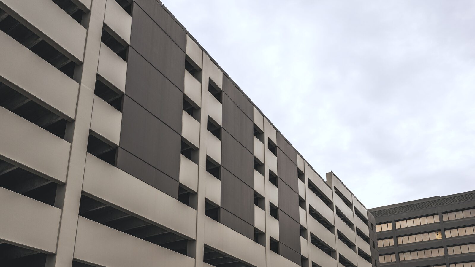 Parking structure facade under an overcast sky